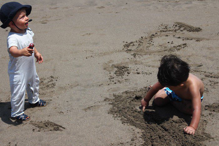 Two toddlers playing on the Beach in Seminyak