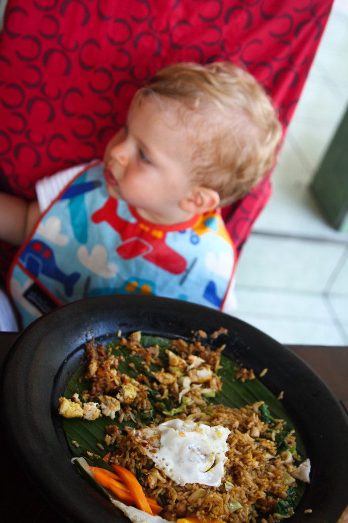 Toddler eating food at Saté Bali