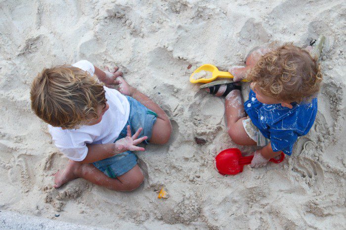Toddlers playing at the beach