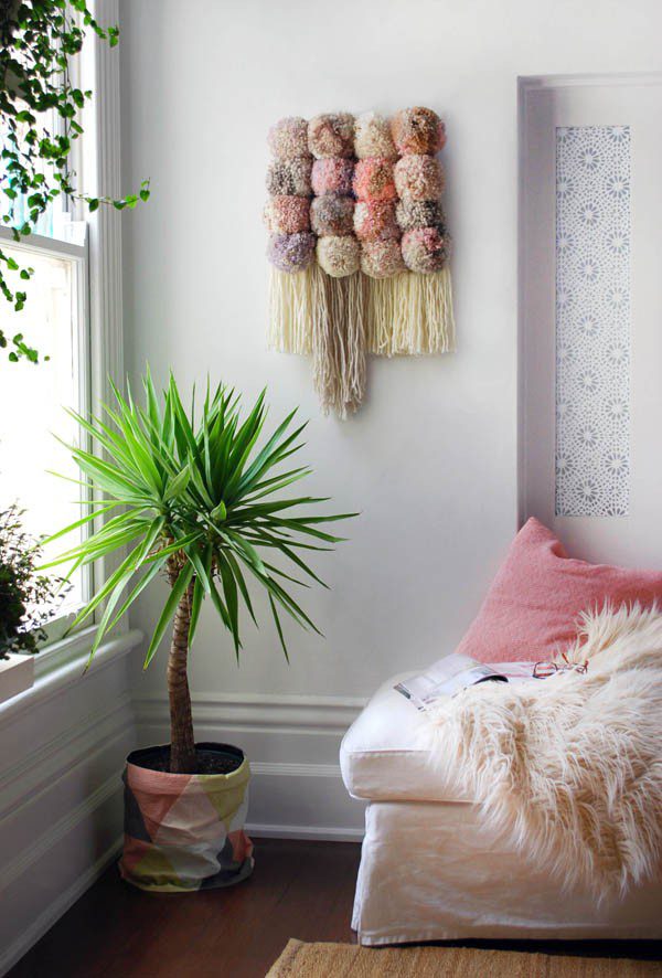 via We Are Scout, link: http://www.we-are-scout.com/2015/04/tutorial-make-a-pom-pom-wall-hanging.html